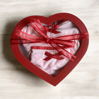 
              Red heart shaped gift box
            
